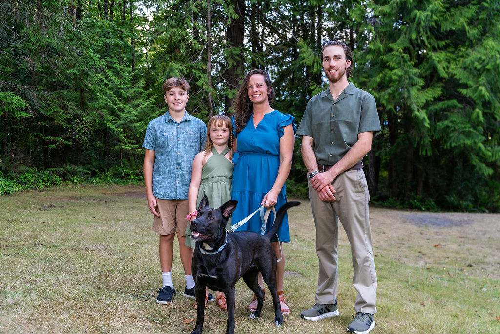 Dog with family at scenic beach state park