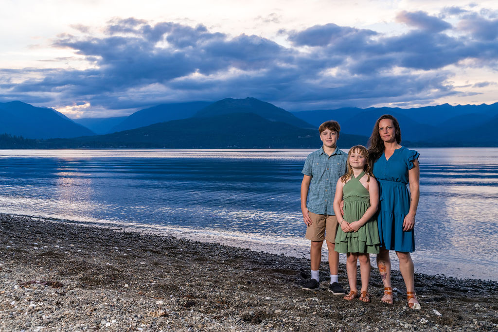 Family photo session with a mother, son and daughter on the shoreline at dusk in Washington