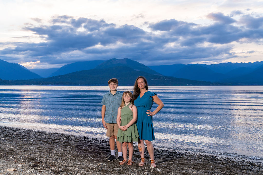 Family photoshoot with them standing at beach at scenic beach State Park.