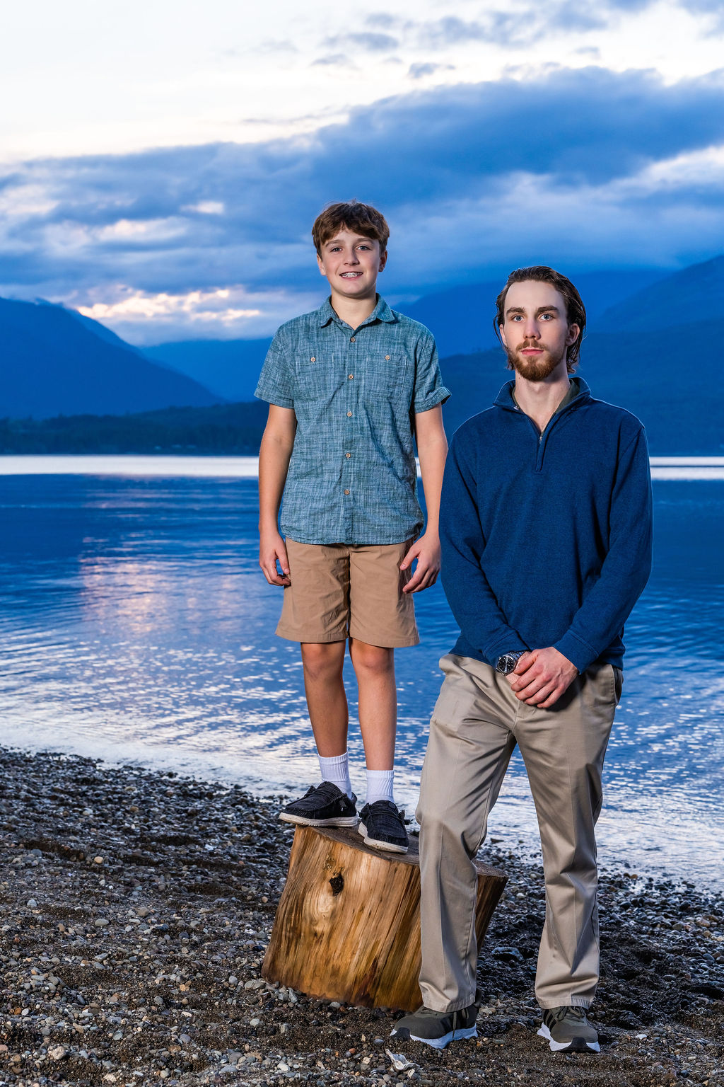 Two brothers standing on the beach at sunset during a family photo session in Washington