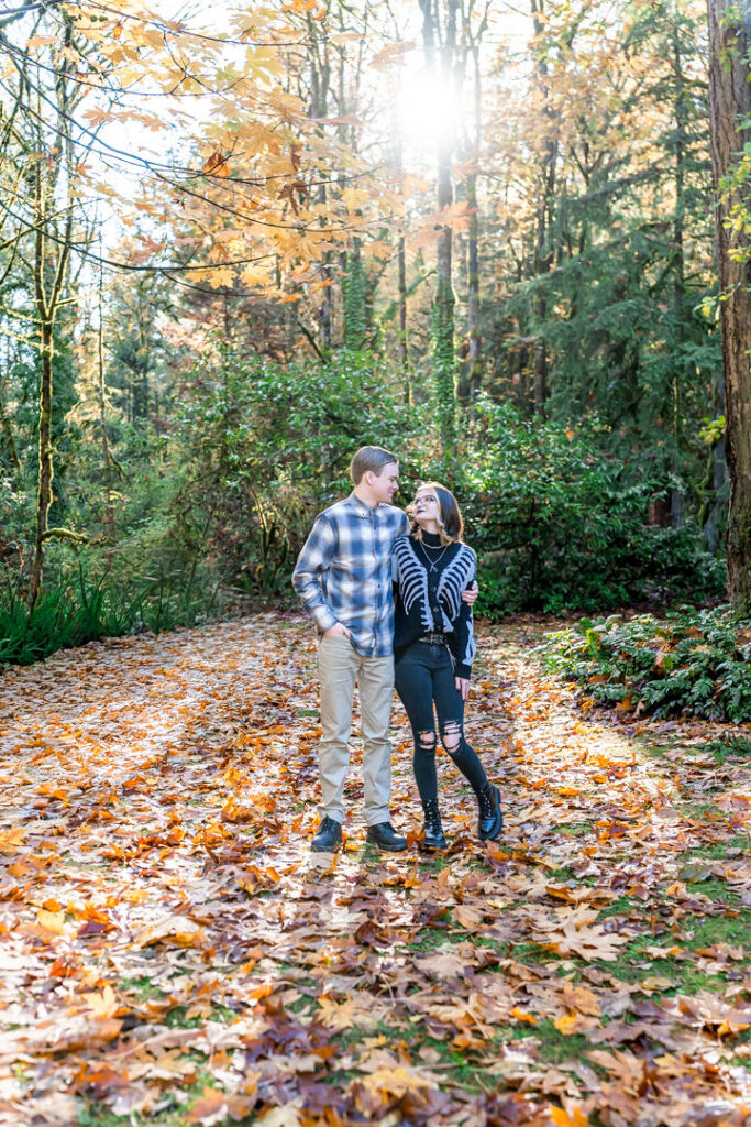 couple posed at Manchester State Park in Fall