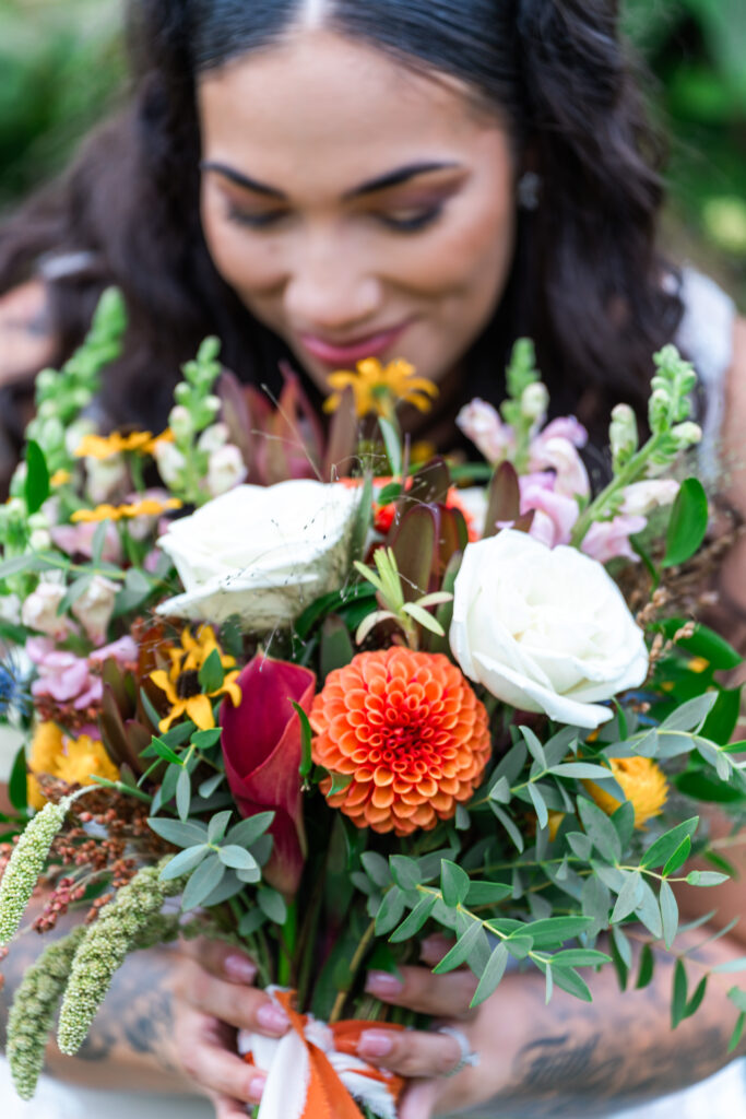 Bride Smelling Flowers at Damian’s Venue located in Tacoma WA.