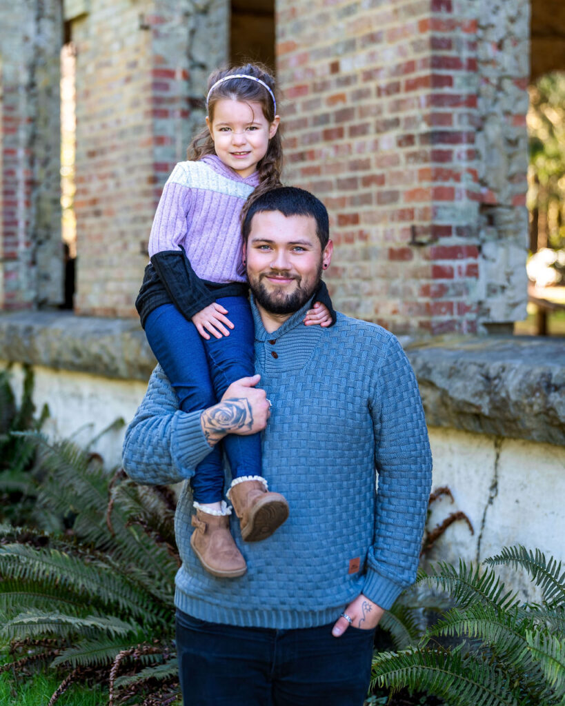 FATHER AND DAUGHTER IN FRONT OF MAIN BUILDING AT MANCHESTER STATE PARK.