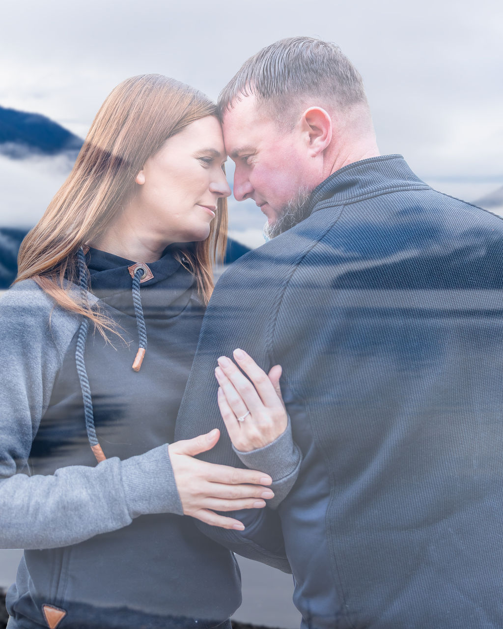 Romantic engagement photo of couple on Lake Crescent dock in Olympic National Park Washington