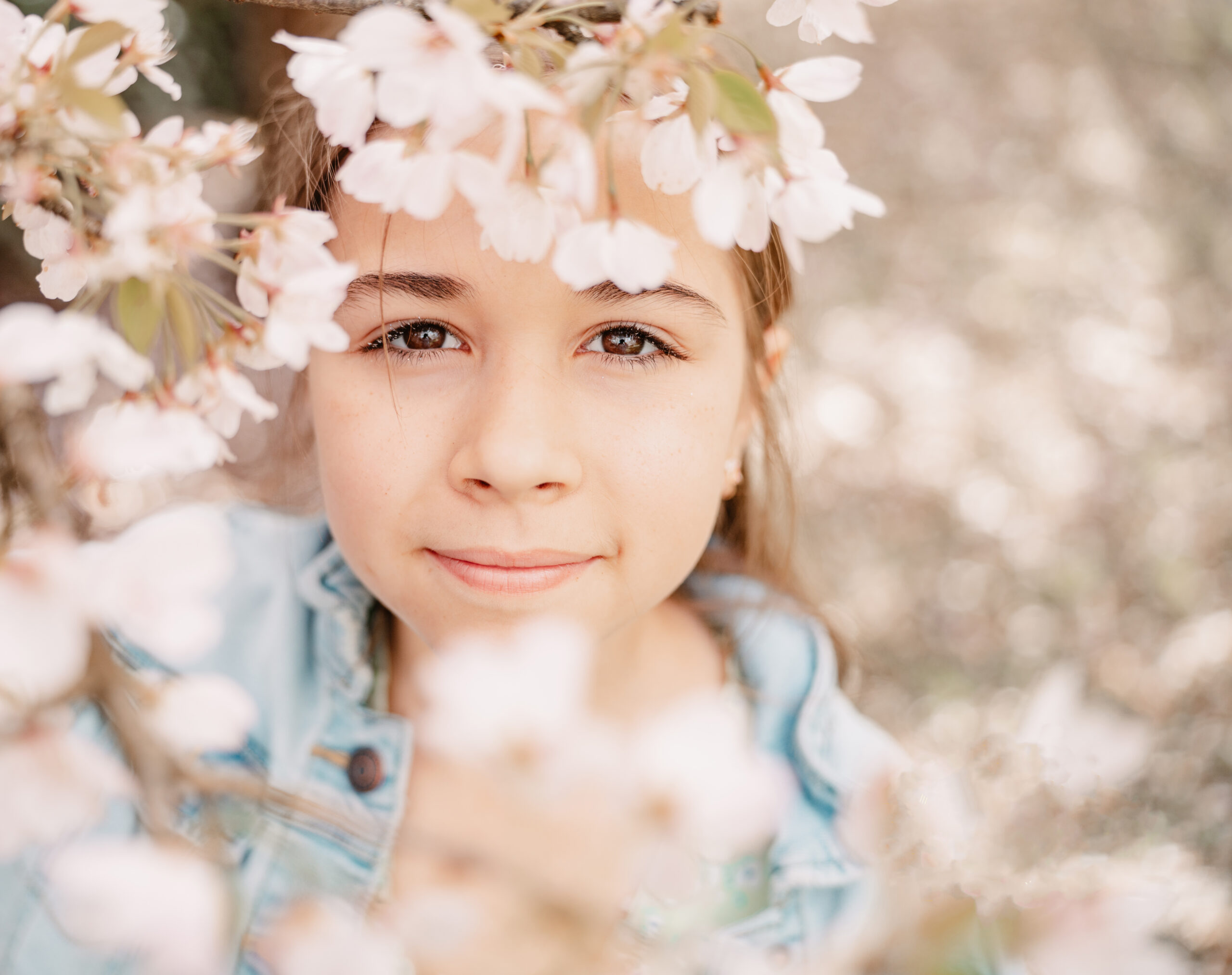 Portrait of young girl with Cherry Blossoms in Bremerton Washington.