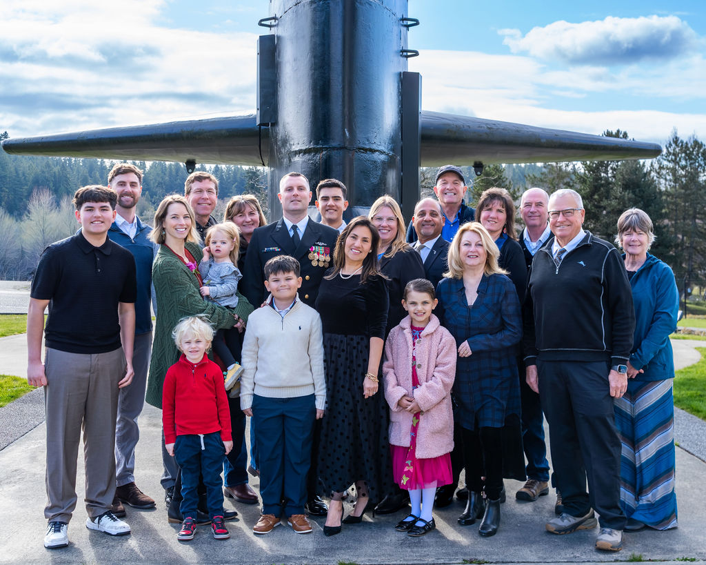 Master chiefs family and friends in front of submarine during retirement ceremony at underwater naval museum in Bremerton.