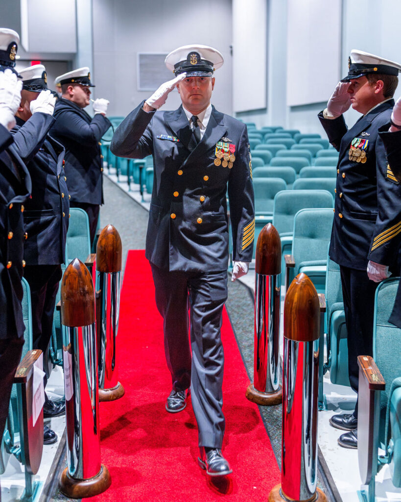 Master Chief saluting during ceremony.