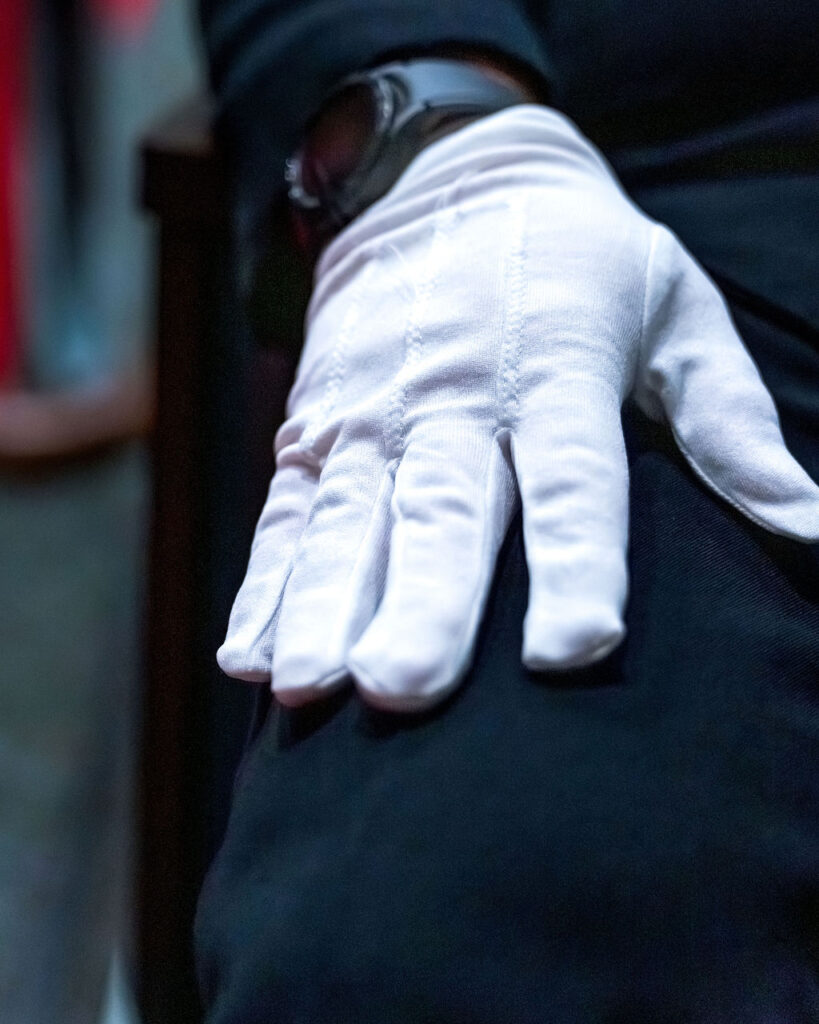 White glove of Chief during ceremony.