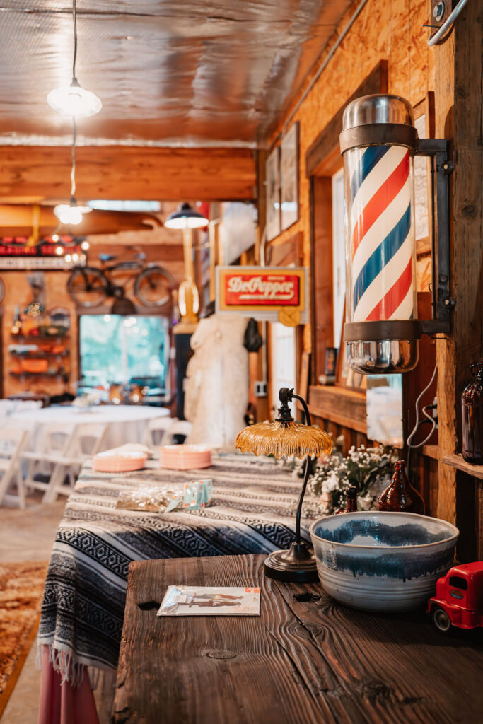 Vintage barber pole and rustic decor inside Burley Creek Nursery wedding venue in Port Orchard Washington