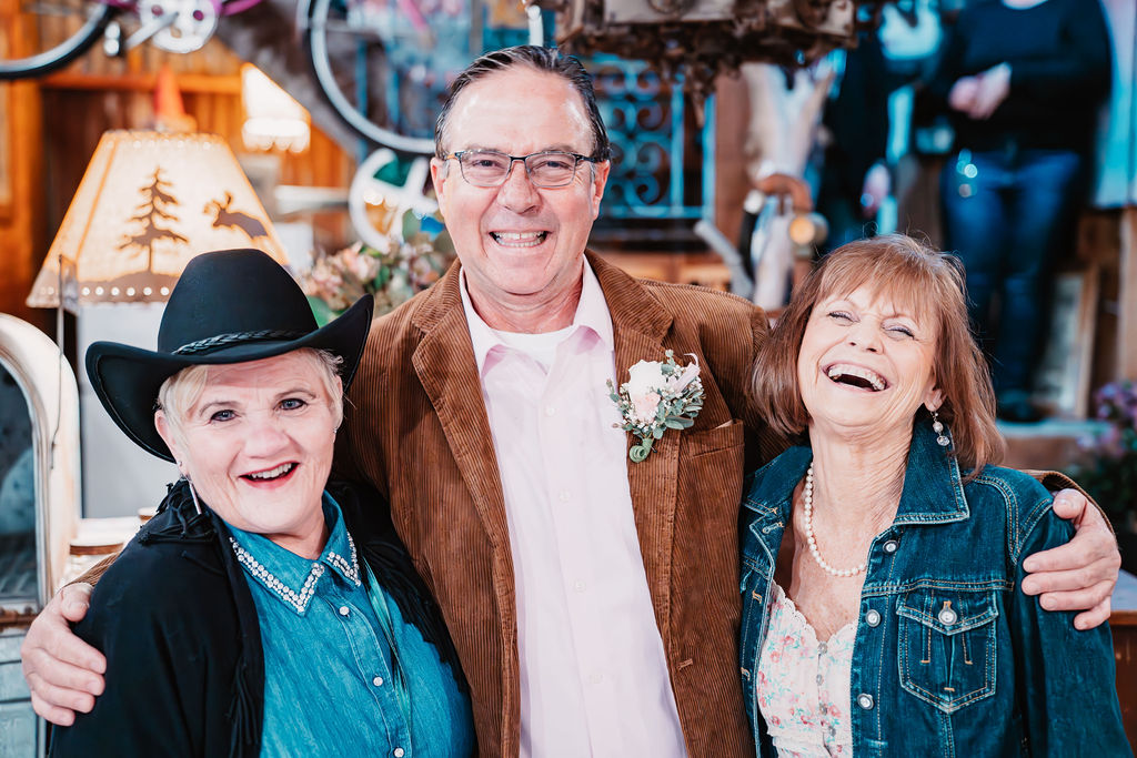 Bride and groom smiling with family members during their wedding celebration at Burley Creek Nursery wedding venue in Port Orchard Washington