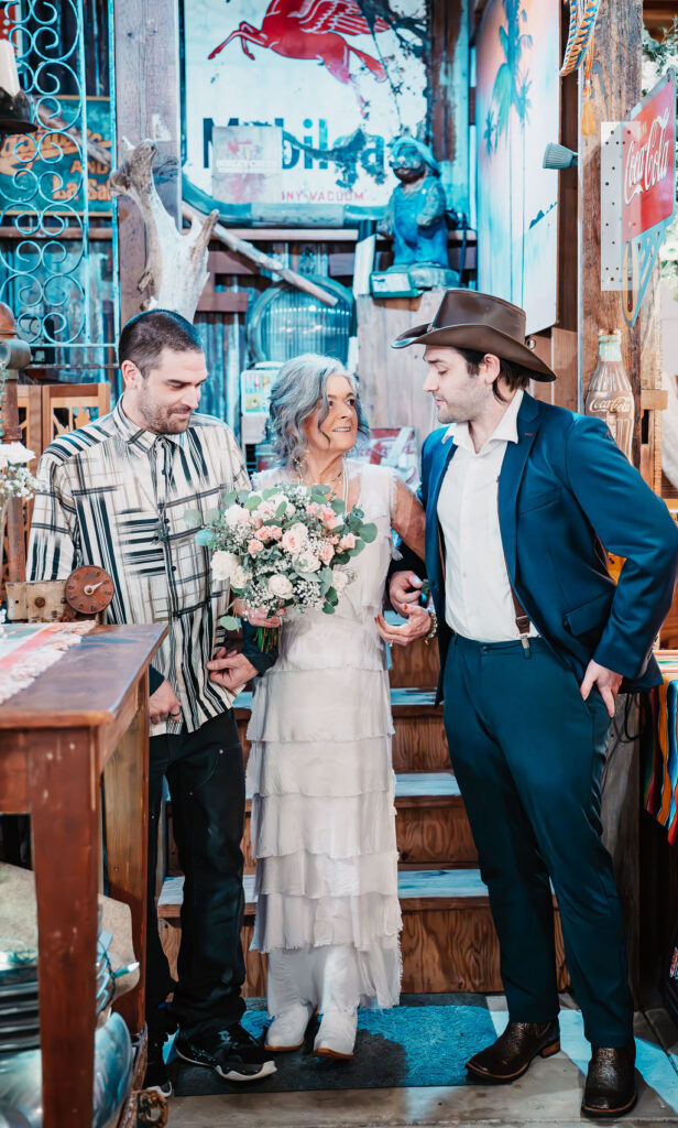 Bride walking with family members inside the rustic barn venue at Burley Creek Nursery wedding venue in Port Orchard Washington
