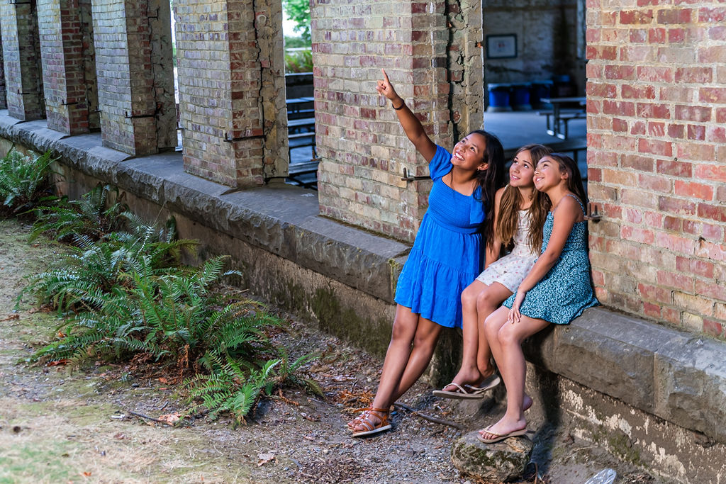 Children wondering in awe at manchester state park in kitsao washignton