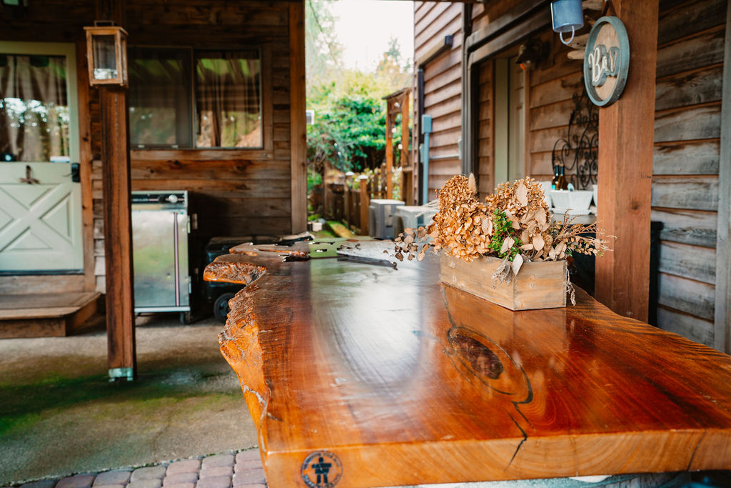 rustic wood bar and outdoor reception area at olalla vineyard wedding venue
