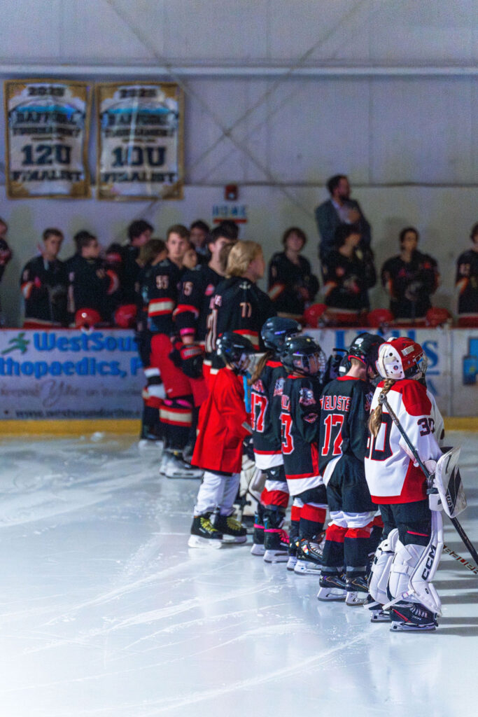 kids lined up on the rink.