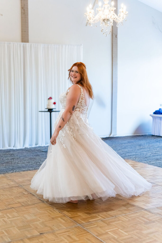 Bride twirling in reception hall at Vickery Gardens wedding venue near Tacoma