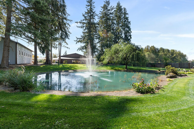 Scenic outdoor wedding venue grounds with a beautiful pond, serving Kitsap County and Tacoma area weddings