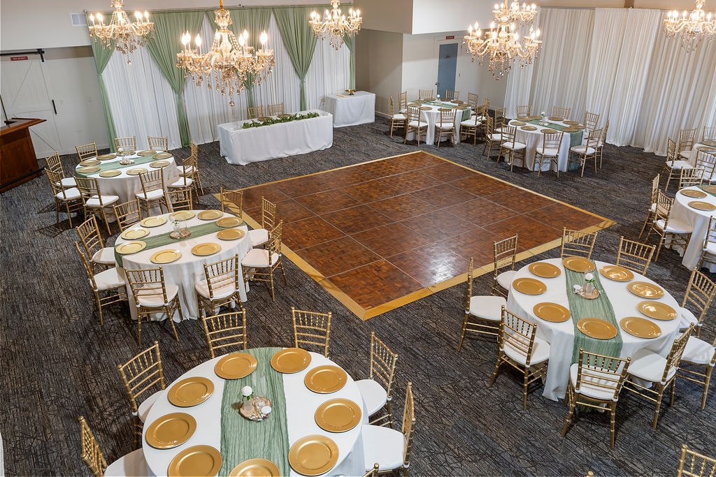Reception hall setup with chandeliers and dance floor at Vickery Gardens wedding venue near Tacoma Washington