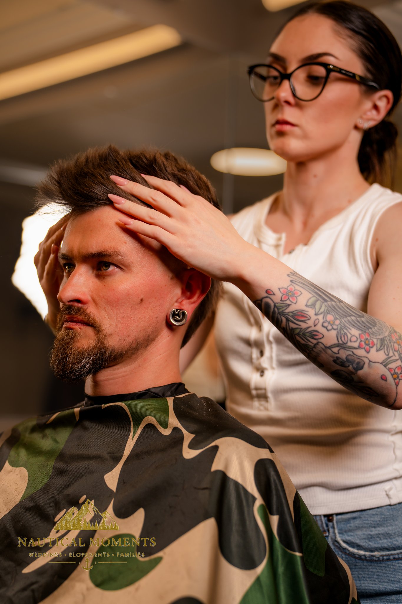 Bremerton branding photographer photo of tattooed barber Kate Wrinkler styling a client's hair