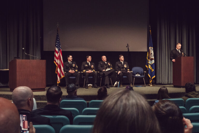 Family and guests listening during a Navy retirement ceremony in Kitsap County
