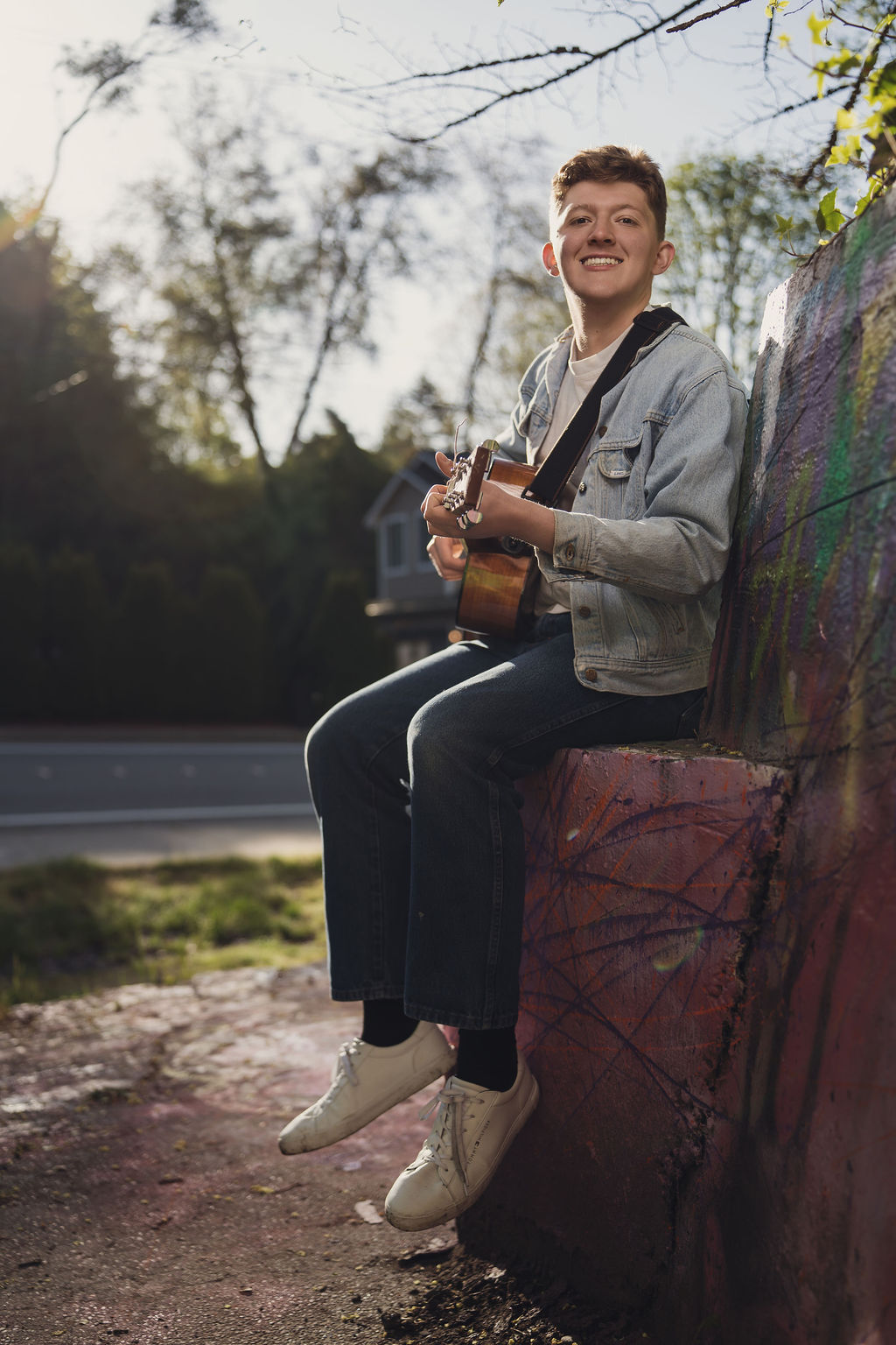 Senior with guitar in nice background in bremerton.