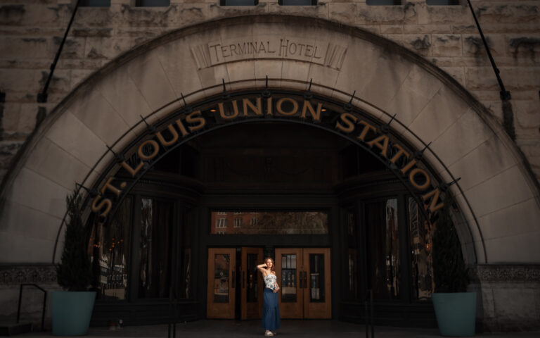 Senior portrait beneath historic architecture in Kitsap County, Washington