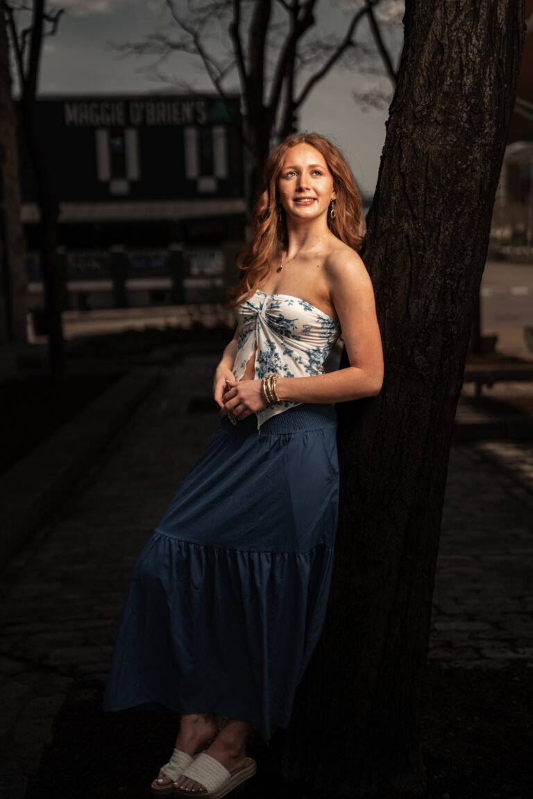 Senior portrait with soft natural hair and makeup in warm light, a fresh camera ready look. hair and makeup senior pictures