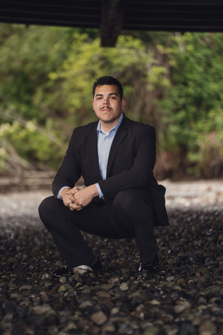 High school senior on a rocky Kitsap beach, a natural counterpoint to a vintage senior session