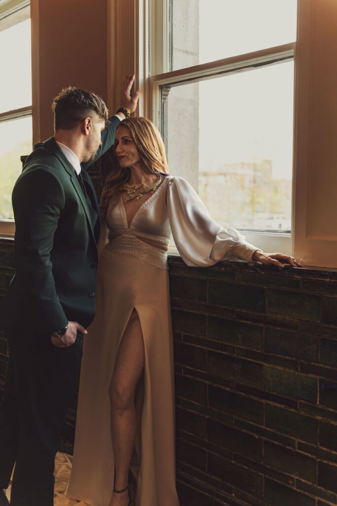Built in time for creatives for wedding client with couple near Window. wedding photography hours coverage