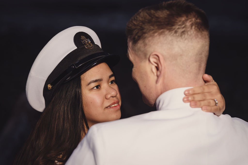 Couple embracing at golden hour at Chambers Bay in Tacoma Washington
