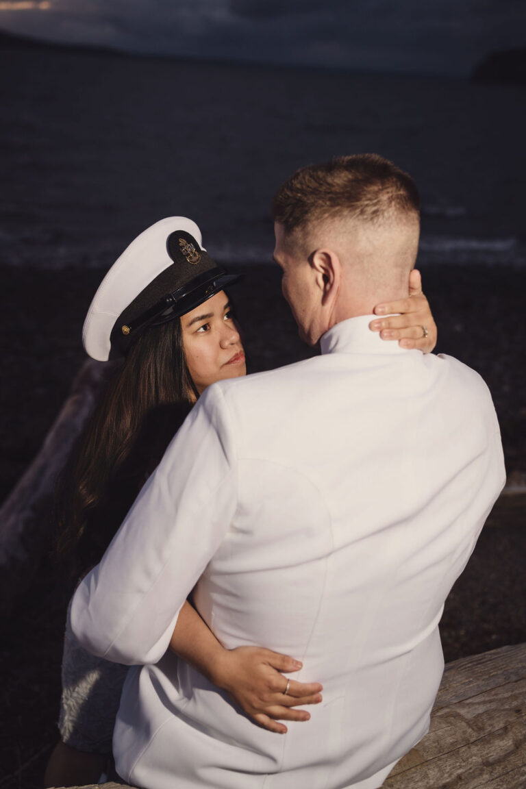 Engaged couple at golden hour at Chambers Bay in Tacoma, a winter engagement photos outfit example