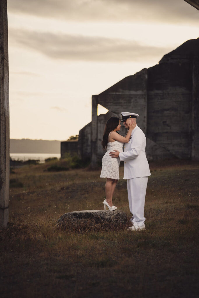 Couple touching foreheads at Chambers Bay during a Puget Sound engagement session