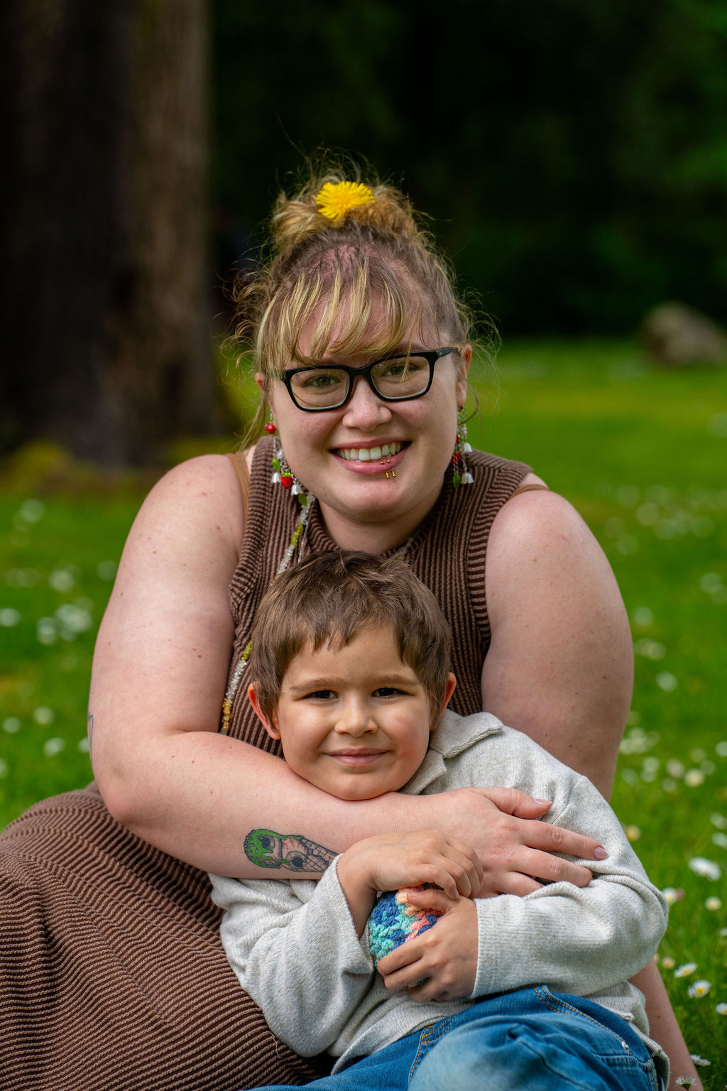 Family photo session with a mother hugging her young son at a park in Kitsap County, Washington