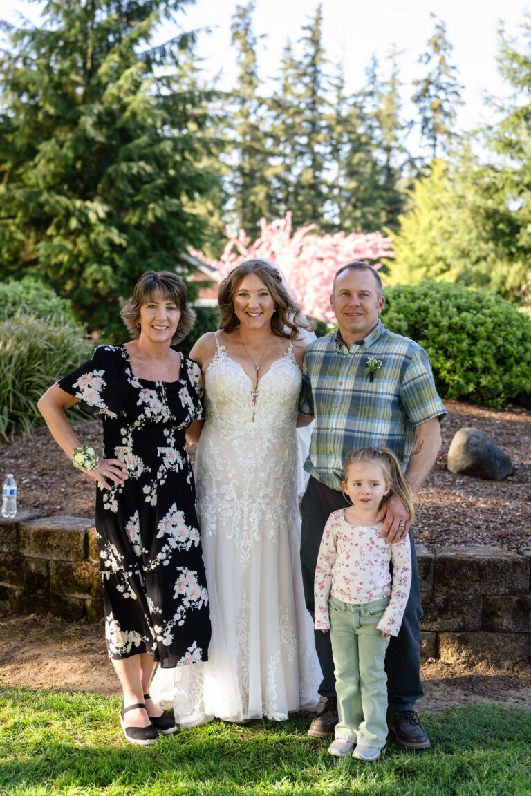 Bride with family at a Mason Jar Gathering Barn wedding in Onalaska, Washington