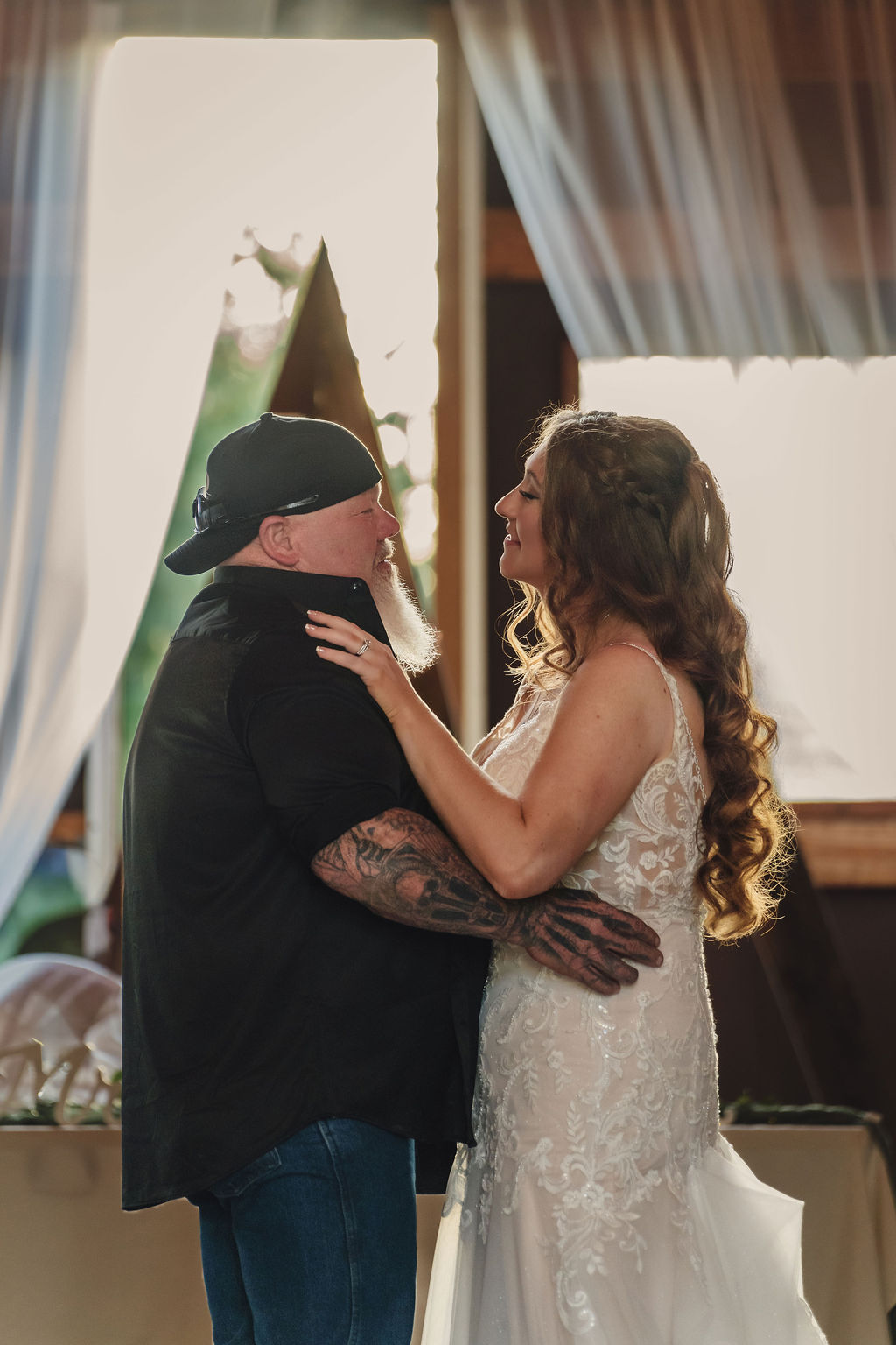 Bride and groom first dance inside the Mason Jar Gathering Barn in Onalaska, Washington