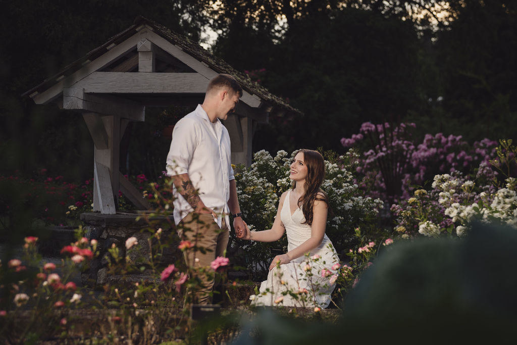 Golden hour engagement photos among the roses at Point Defiance Park