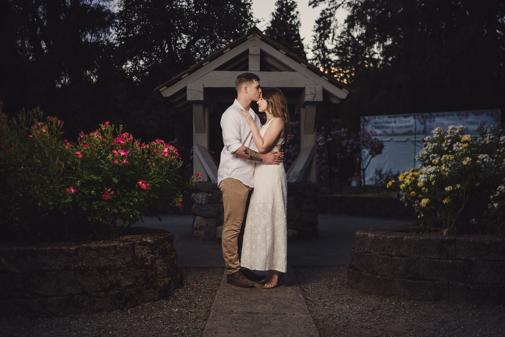 Tacoma engagement session in front of blooming red roses