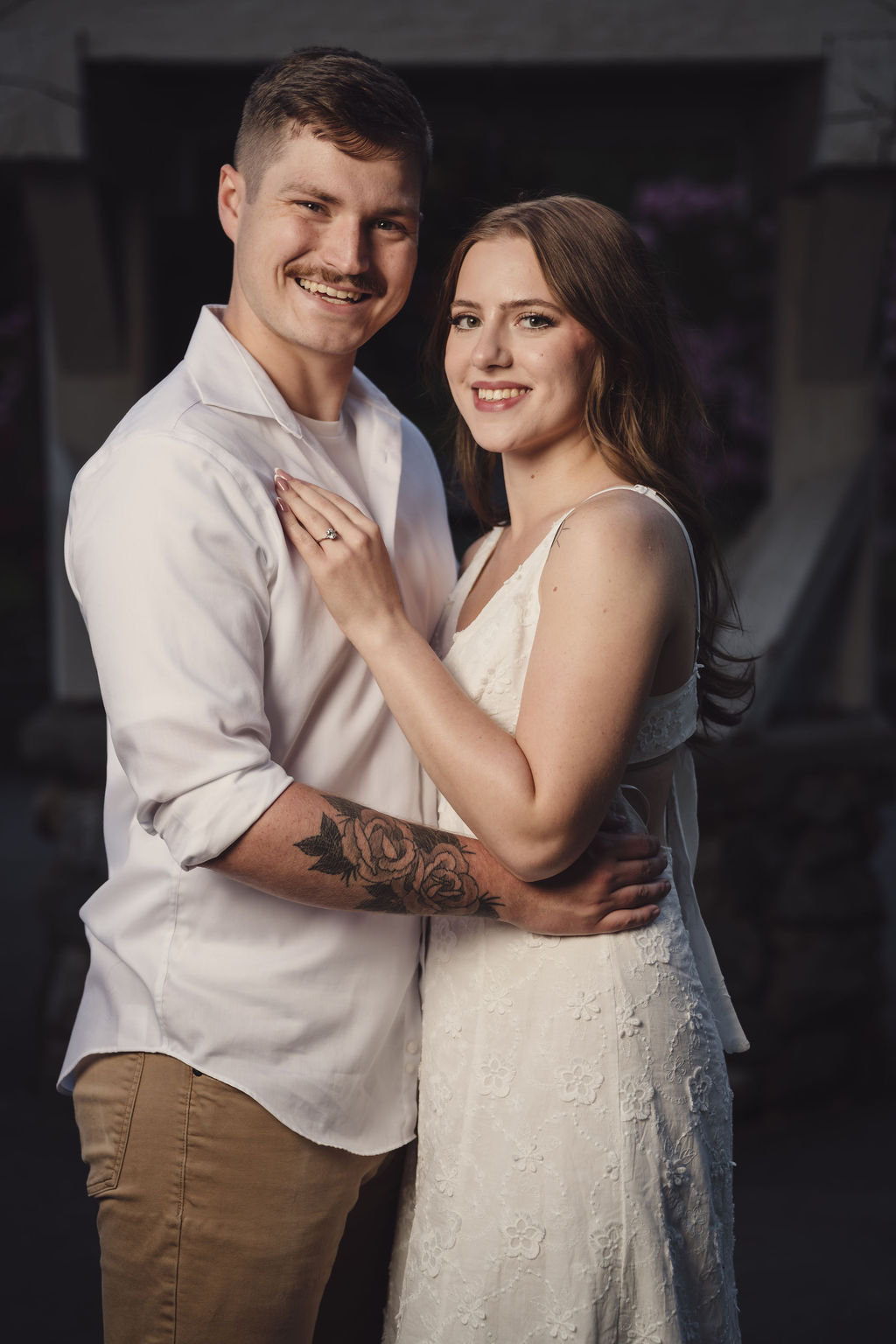 Engagement photos under the gazebo at Point Defiance Rose Garden