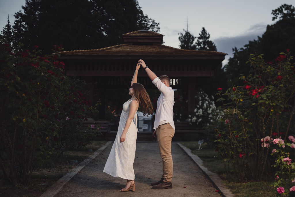 Engagement twirl in front of the rose garden gazebo at Point Defiance