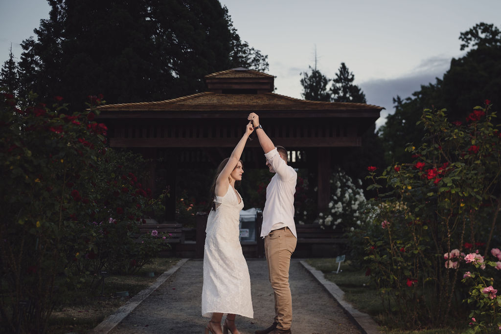 Soft evening light engagement photos in the Point Defiance Rose Garden