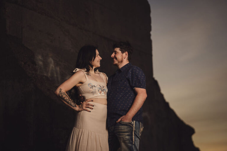 Couple gazing at each other at golden hour at Chambers Bay near Tacoma