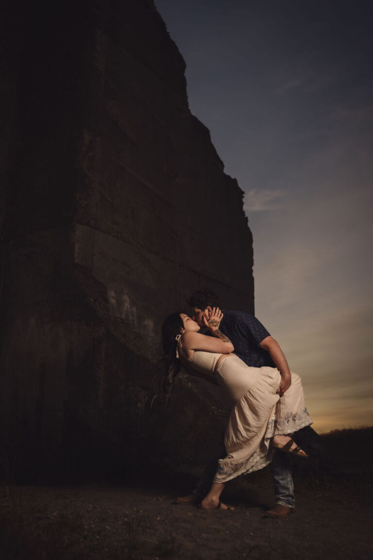 Couple in a dip pose at golden hour at Chambers Bay near Tacoma