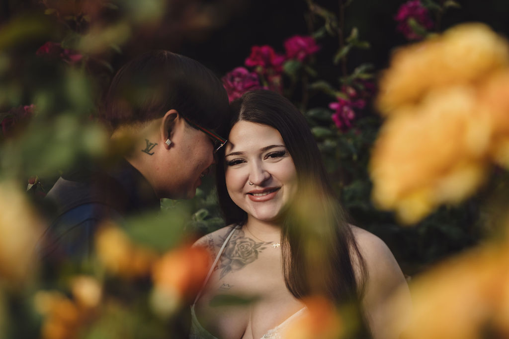 Couple in white gown and black suit posing in the formal rose garden at Point Defiance, Tacoma WA, Nautical Moments Photography