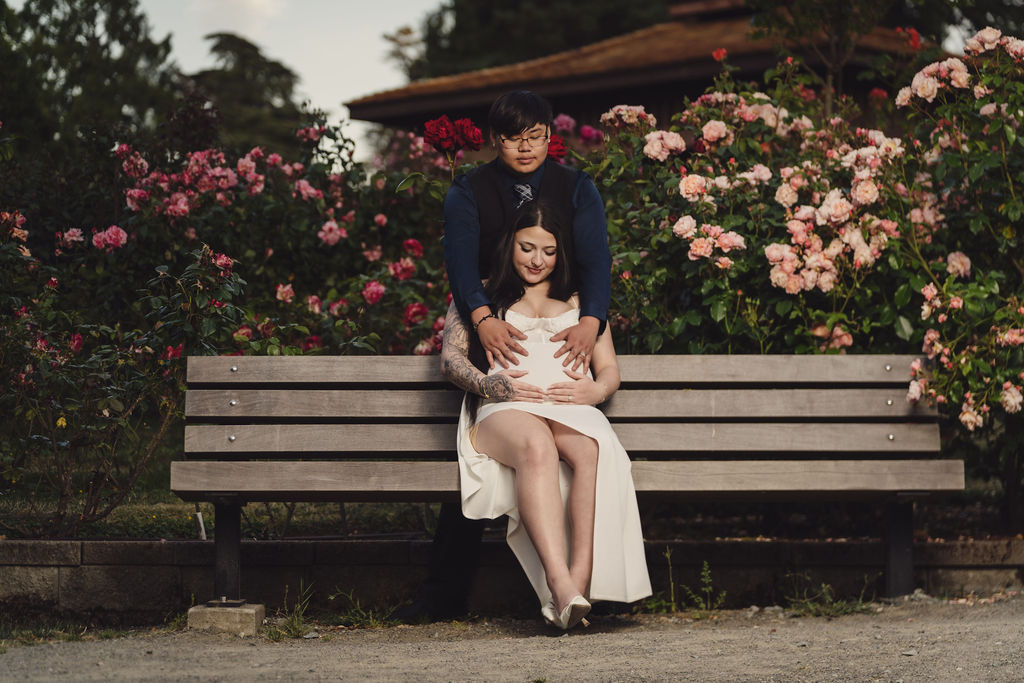 Couple in backlit golden hour light at Point Defiance Rose Garden, Tacoma, engagement session by Nautical Moments Photography