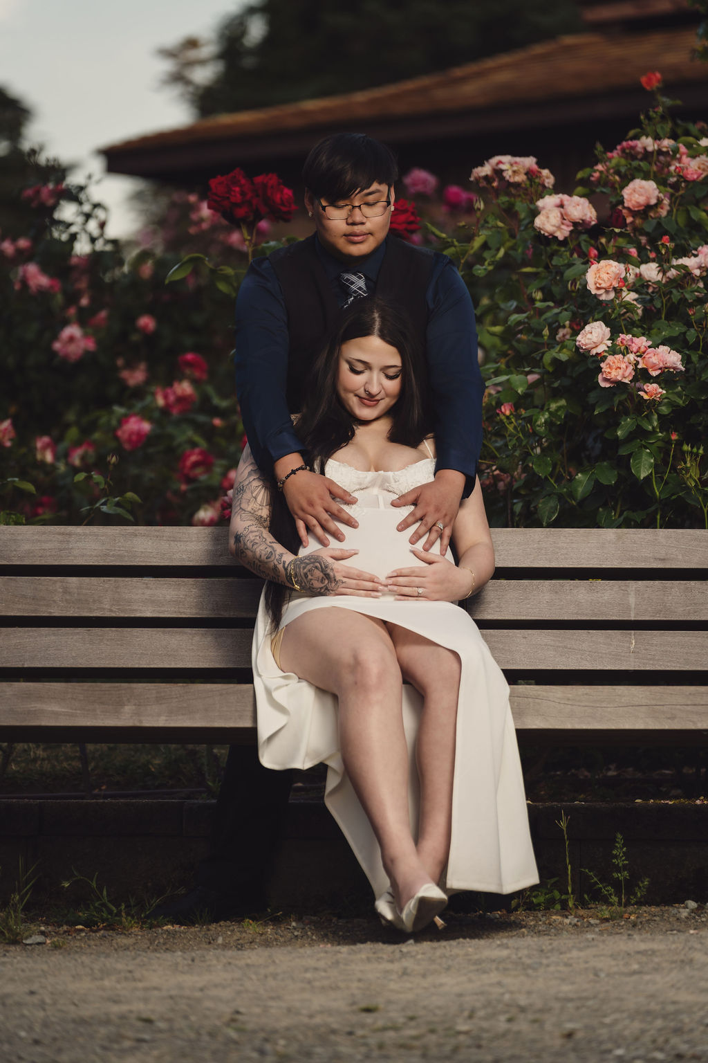 Intimate close portrait of a couple at Point Defiance Rose Garden, Tacoma, backlit engagement session by Nautical Moments Photography