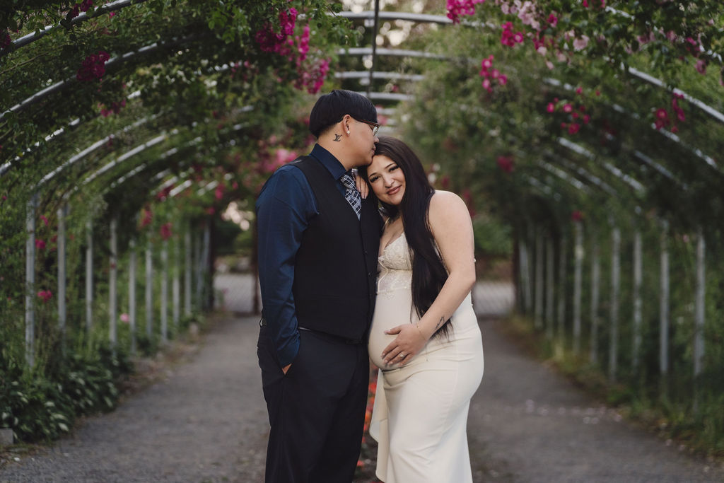 Couple in white gown and black suit walking through the rose garden at Point Defiance Park, Tacoma, Nautical Moments Photography