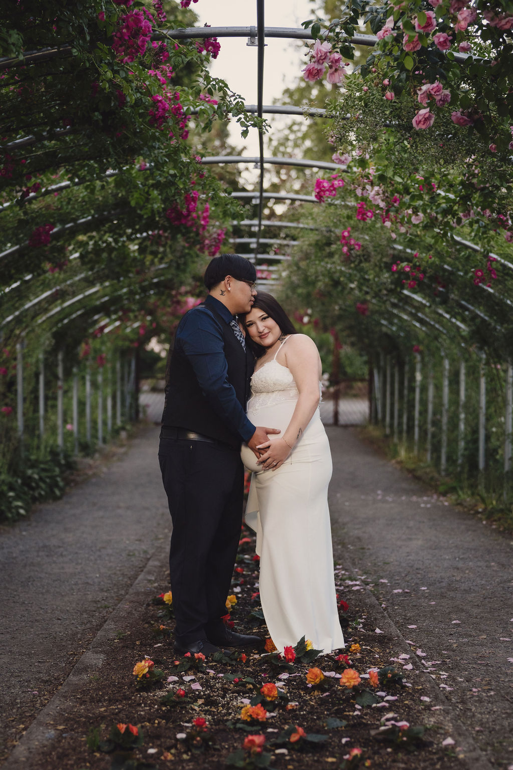 Formal engagement portrait among rose blooms at Point Defiance Park, Tacoma, photographed by Nautical Moments Photography