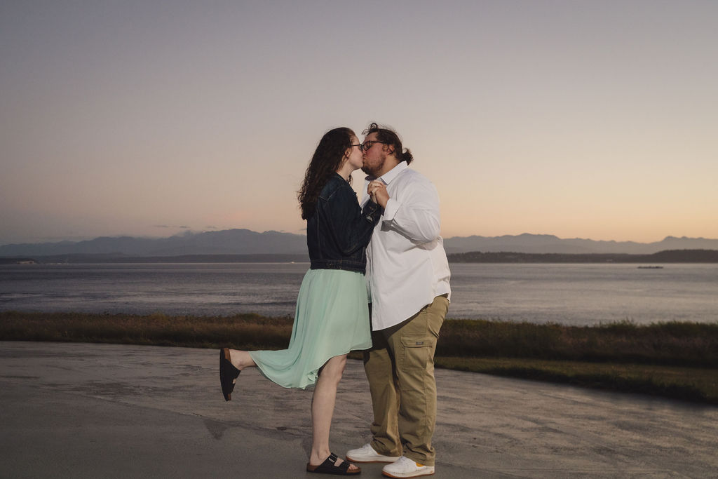 Couple kissing at sunset during a Fort Casey engagement session