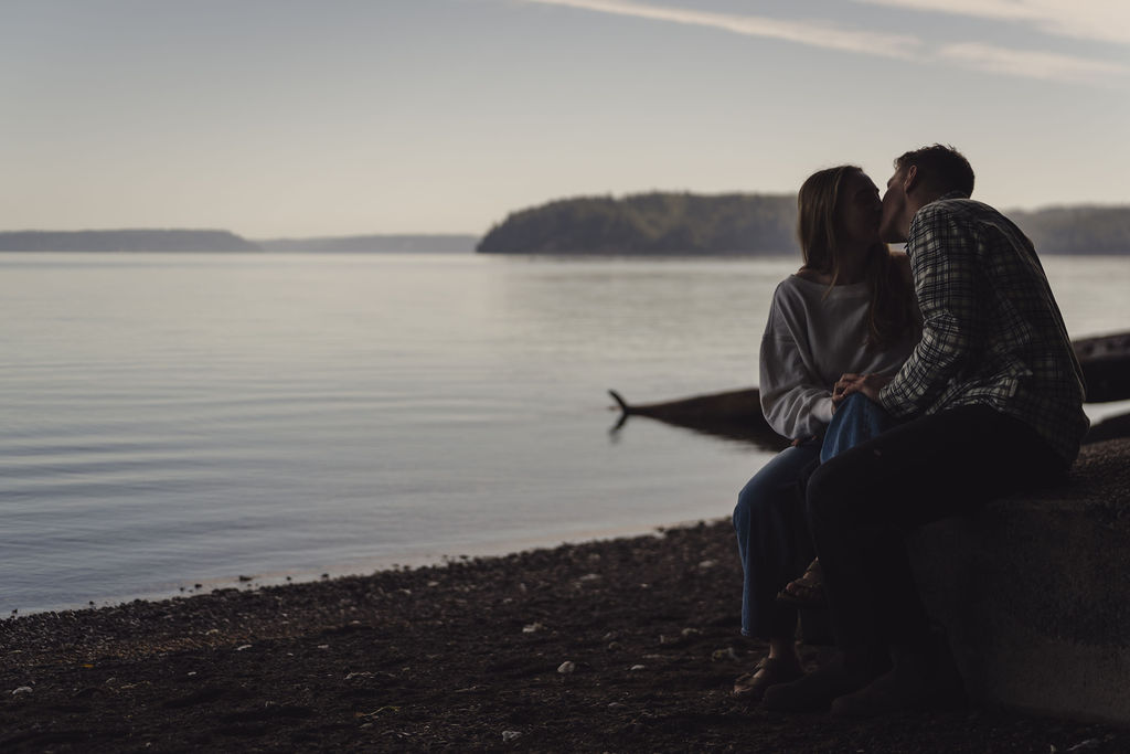 Engagement photos at dusk on the Hood Canal shoreline at Scenic Beach State Park in Kitsap County