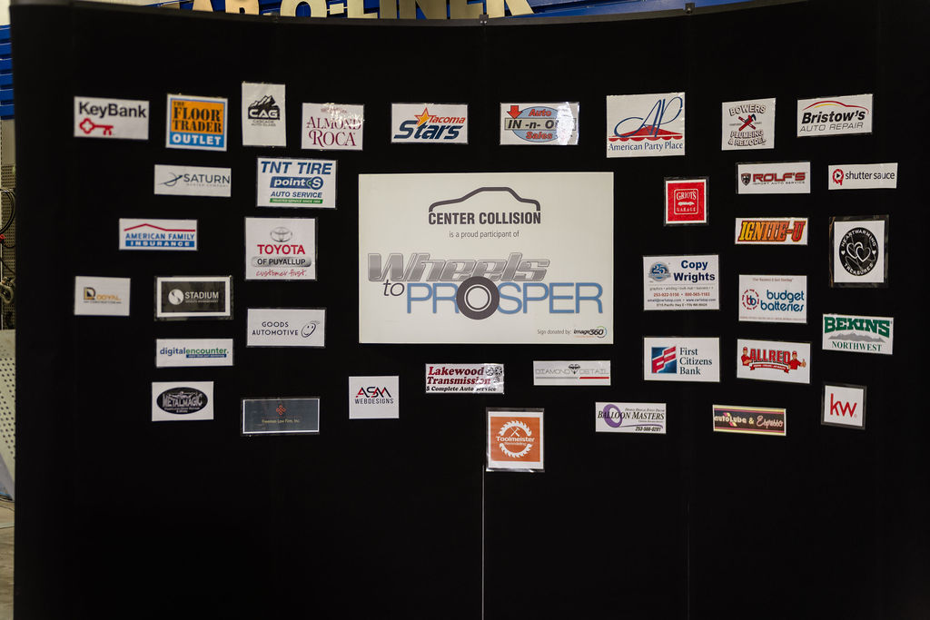 Sponsor logo board showing local businesses supporting the Wheels to Prosper giveaway