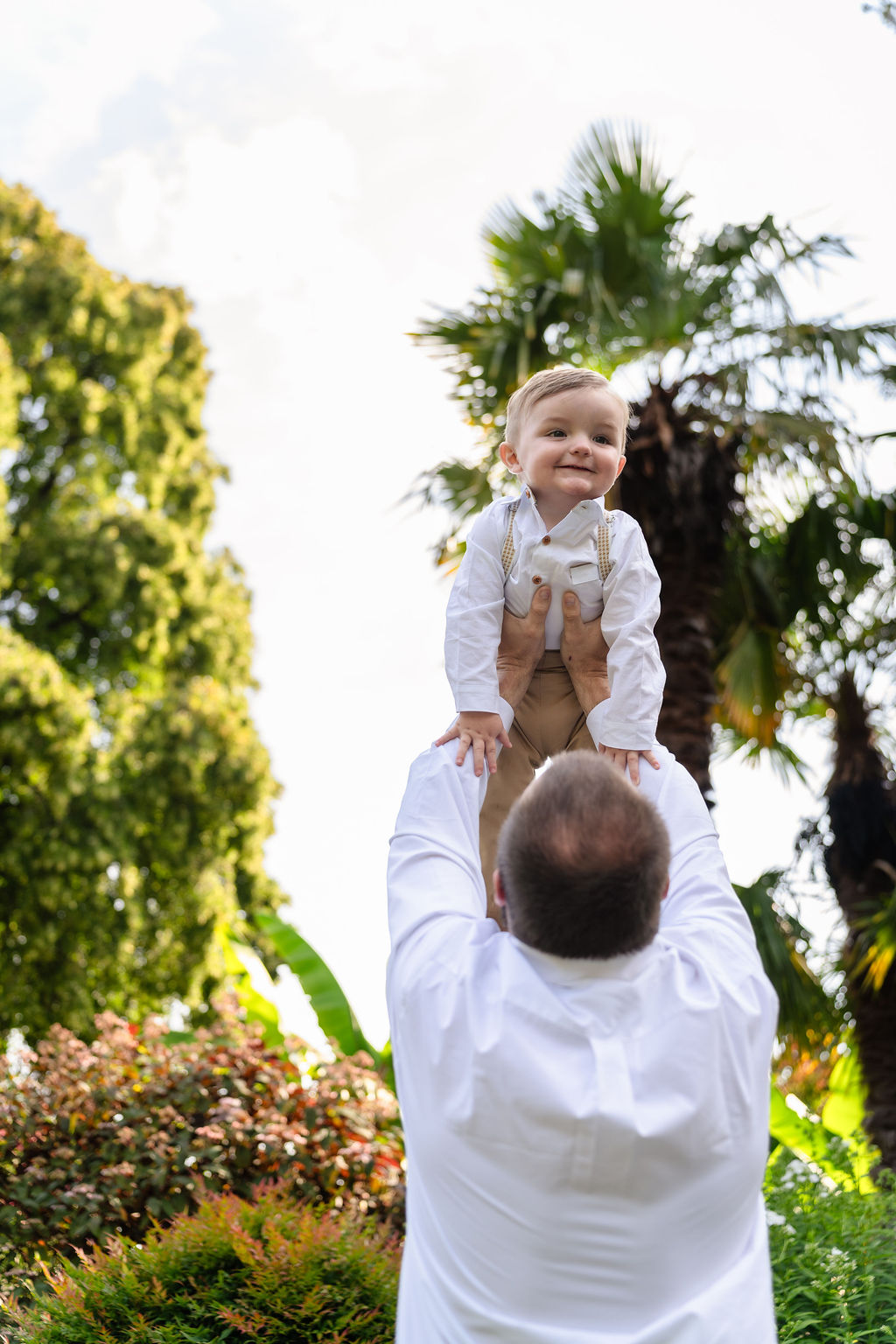 Dad lifting his son overhead during a family session at Point Defiance Park in Tacoma